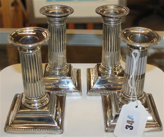 Matched set of four Victorian silver Corinthian column candlesticks (two pairs)